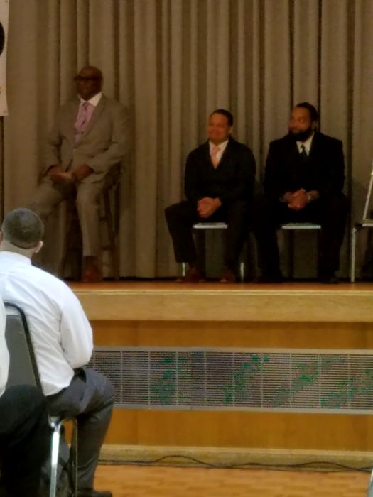 Honored guests seated on stage during the ceremony